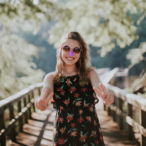 Fashionista enjoys the outdoors wearing NOZ reef safe sunscreen in purple